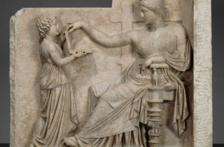Does This Greek Sculpture Show Its Subject Using A Laptop?